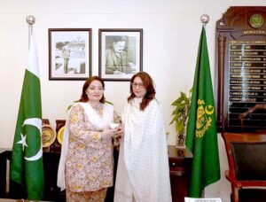 PM'S Coordinator on Climate Change & Environmental Coordination Romina Khurshid Alam presenting a sapling to Uzma Yusuf, Cambridge International's Country Director for Pakistan