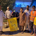 Cantonment Board staff handing over litter bags to the people who are sacrificing animals to dispose wastes of the animals on Eid-ul-Adha