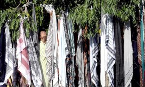 A street vendor offers herbal teeth-cleaning sticks collected from various trees at his stall near a mosque in Abbpara, the Federal Capital