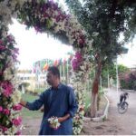 A person busy in decorating the entrance for preparation of Eidul Azha prayer at Polo Ground