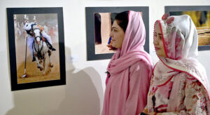 A female art enthusiast stands captivated by a painting at the Annual Members Photographic Competition & Exhibition. In collaboration with the Islamabad Club and Islamabad Camera Club, PNCA in Federal Capital