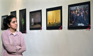 A female art enthusiast stands captivated by a painting at the Annual Members Photographic Competition & Exhibition. In collaboration with the Islamabad Club and Islamabad Camera Club, PNCA in Federal Capital