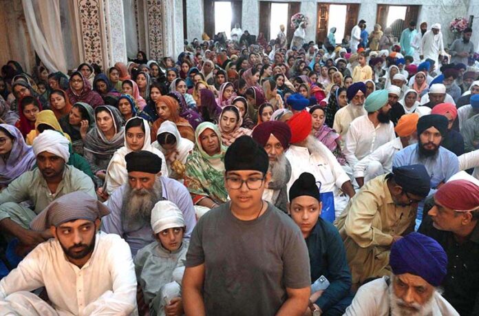 Sikh pilgrims performing religious rituals at Gurdwara as Sikh pilgrims from India and other countries arrived in Pakistan to take part in religious rituals for the fifth Sikh Guru Arjan Dev Ji’s 418th death anniversary