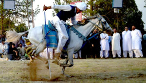 Tent Peggers aiming their targets during the 12 Tent Pegging Competition organized by CDA at F-9 Park.