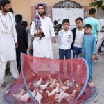 A vendor is selling chickens at Bird market