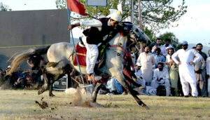 Tent Peggers aiming their targets during the 12 Tent Pegging Competition organized by CDA at F-9 Park.
