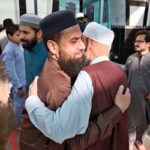 Faithful exchanging Eid greetings with each other after Eidul Azha prayers at Jamia Masjid Zia ul Aloom Satellite Town E-Block