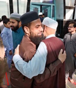Faithful exchanging Eid greetings with each other after Eidul Azha prayers at Jamia Masjid Zia ul Aloom Satellite Town E-Block