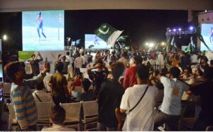 Spectators watching cricket match between India and Pakistan on big screen at Arts Council during ICC Men's Twenty20 World Cup in New York