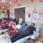 Donors giving blood during Blood Donation Drive organised at Regional Blood Donor Center of Pakistan Red Crescent in connection with World Blood Donor Day 2024