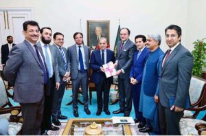 Federal Minister for Finance and Revenue Muhammad Aurangzeb presenting a copy of Economic Survey of Pakistan 2023-2024 to Prime Minister Muhammad Shehbaz Sharif prior to its official launch