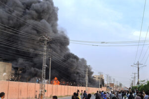 Smoke billowing out of a grid station in the Mumtazabad area of the city after it caught fire Thursday evening while rescuers are busy inside in fire extinguishing.