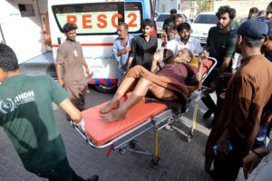 Medical staff giving treatment to the person at civil hospital who sustains burn injuries after cylinder explosion at Bhit Shah.