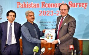 Dr. Imtiaz Ahmad, Economic Adviser, Finance Division presenting copy of Pakistan Economic Survey to Finance Minister Senator Muhammad Aurangzeb at Launch Ceremony of Pakistan Economic Survey 2023-24