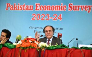 Dr. Imtiaz Ahmad, Economic Adviser, Finance Division presenting copy of Pakistan Economic Survey to Finance Minister Senator Muhammad Aurangzeb at Launch Ceremony of Pakistan Economic Survey 2023-24