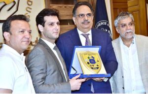 President of the Chamber of Commerce and Industry Abdul Ghafoor Malik is giving a commemorative shield to Director Arslan Mir, the head of Foreign Services Academy delegation.