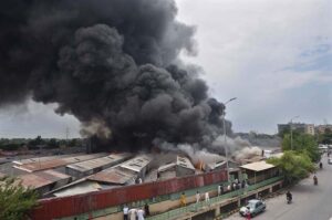A view of smoke emitting after horrific fire erupts in weekly bazaar in H-9 sector. According to CDA as many as 300 stalls burnt to ashes in the incident. Luckily no causalities reported in the incident