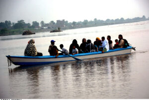 Tourist family enjoy boat riding at Ravi River.
