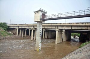 A water level scale in Nullah Lai shows the water level decreased after heavy rain and the situation is under control in the Federal Capital.