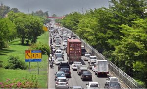 A massive traffic jam ensnares people in long waits, under the blazing sun, enduring the sweltering weather during peak hours in twin cities.
