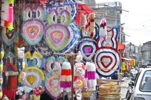 A local vendor showcases beautiful garlands made with currency notes at his shop at Bani Chowk neighbourhood in the city.