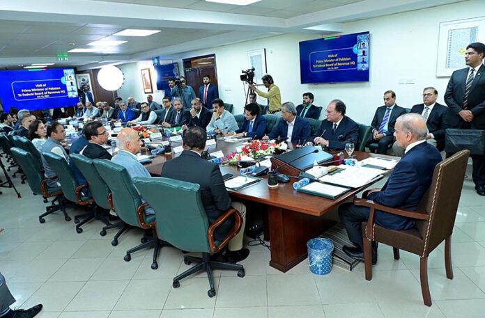Prime Minister Muhammad Shehbaz Sharif addressing officers during his visit to headquarters of the Federal Board of Revenue
