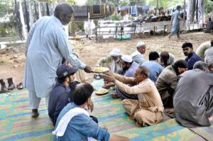 Volunteers distribute free meals to laborers and those in need, ensuring no one goes hungry during challenging times at Aabpara in Federal Capital