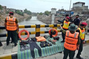 Rescue 1122 official standing alert on bridge over Nullah Lai at Guwalmandi as pre-monsoon spell is expected to start from Thursday to Sunday and assured that all necessary arrangements have been made in this regard by Rawalpindi Development Authority (RDA).