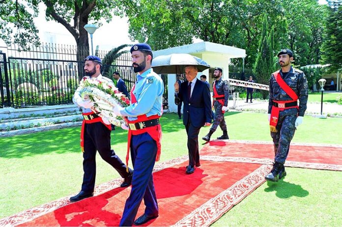 Prime Minister Muhammad Shehbaz Sharif laying a floral wreath at the Yadgar-e-Shuhada at the FBR Headquarters