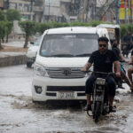 Children enjoy riding bicycles on a rainy day