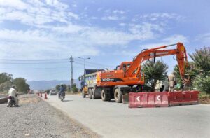 Heavy machinery being used during extension work of Club Road during development work in Federal Capital