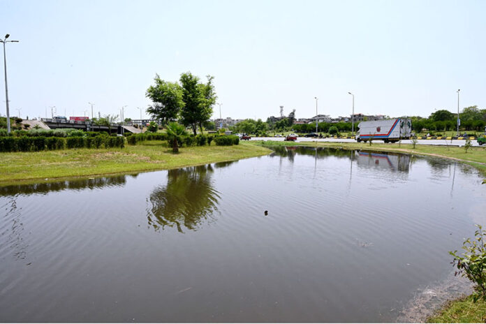 A view of accumulated rainwater after last night's heavy rain at Faizabad Flyover in the Federal Capital