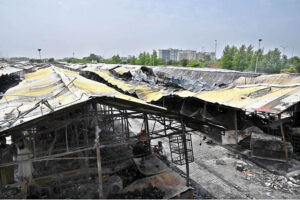 Stall holders examine and collecting the burnt remains of their stalls which burnt due to yesterday’s fire at the H-9 Weekly Bazaar