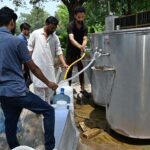 People filling their pots with clean drinking water from filtration plant at F-6 in the Federal Capital