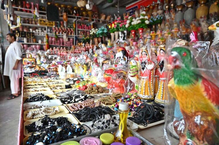 A family selecting and purchasing decoration items and other stuff from