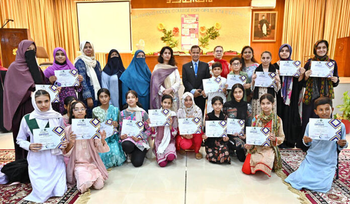 CEO International Governance and Sustainability Institute Dr. Sultan Azam Temuri awarding certificates among students in closing ceremony of Summer Fiesta Program organized by Federal Ministry of Education held at IMCG F-7/4