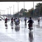 Vehicles on the way at Airport Road during rain that experienced the Twin Cities