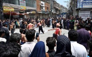 Mourners oozing themselves with knives and chains during Aashura procession on 10th of Holy Month of Muharramul Harram. Muharram is the mourning month in remembrance of the Shahadat of Hazrat Imam Hussain (RA), the grandson of the Holy Prophet Mohammad (PBUH).