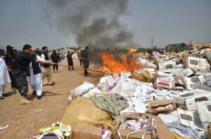 Director Customs Intelligence Karam Elahi set ablaze cigarettes, beta nuts & miscellaneous items at Shahkas district Khyber.