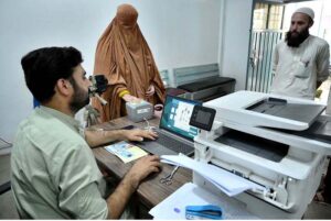 A female Afghan refugee provides fingerprints for updating her Proof of Registration (POR) card at the PCM center in Chamkani, following the government's extension until June 30, 2025.