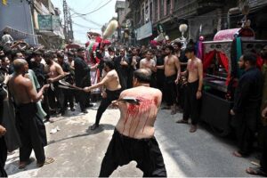 Mourners oozing themselves with knives and chains during Aashura procession on 10th of Holy Month of Muharramul Harram. Muharram is the mourning month in remembrance of the Shahadat of Hazrat Imam Hussain (RA), the grandson of the Holy Prophet Mohammad (PBUH).