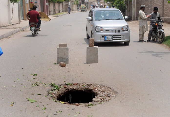 A view of the damaged road near the excise office may cause any mishap that needs the attention of concerned authorities