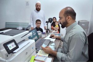 A female Afghan refugee provides fingerprints for updating her Proof of Registration (POR) card at the PCM center in Chamkani, following the government's extension until June 30, 2025.