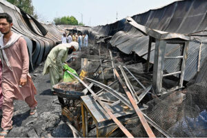 Stall holders examine and collecting the burnt remains of their stalls which burnt due to yesterday’s fire at the H-9 Weekly Bazaar
