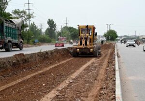 Heavy machinery being used during extension work of Club Road during development work in Federal Capital.