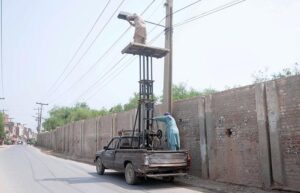 The staff of the Municipal Corporation is busy repairing the street lights near Dolat Gate.