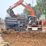 Heavy machinery being used for extension of IJP Road during development work in the Federal Capital