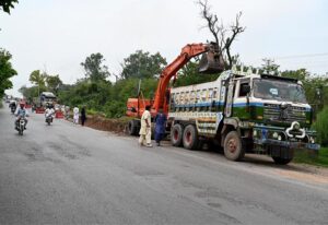 Heavy machinery being used during extension work of Club Road during development work in Federal Capital.