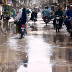 A view of sewerage water accumulated on the road at Liaqat colony