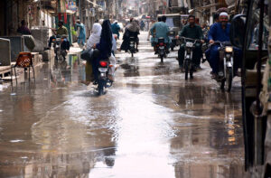 A view of sewerage water accumulated on the road at Liaqat colony